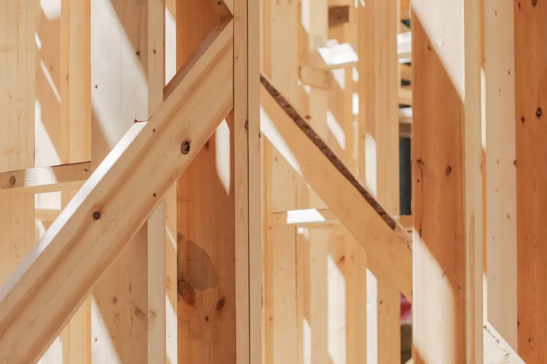 Interior wall framing, studs and beams in a house being remodeled